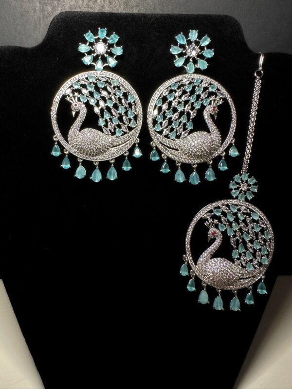 Own the Spotlight: Dazzle in this Mehram Chandbali Earrings & Tikka Set