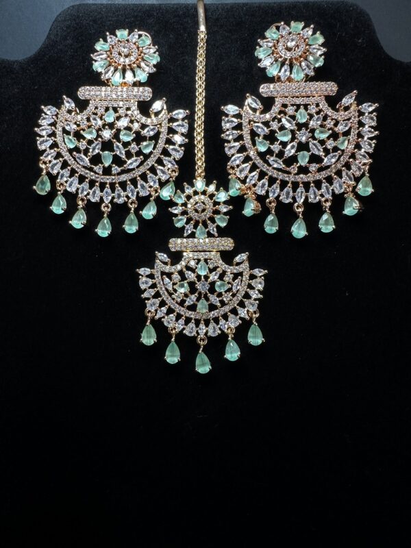 Own the Spotlight: Dazzle in this Mehram Chandbali Earrings & Tikka Set